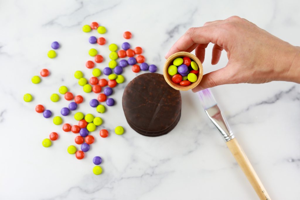 filling the cone with candies